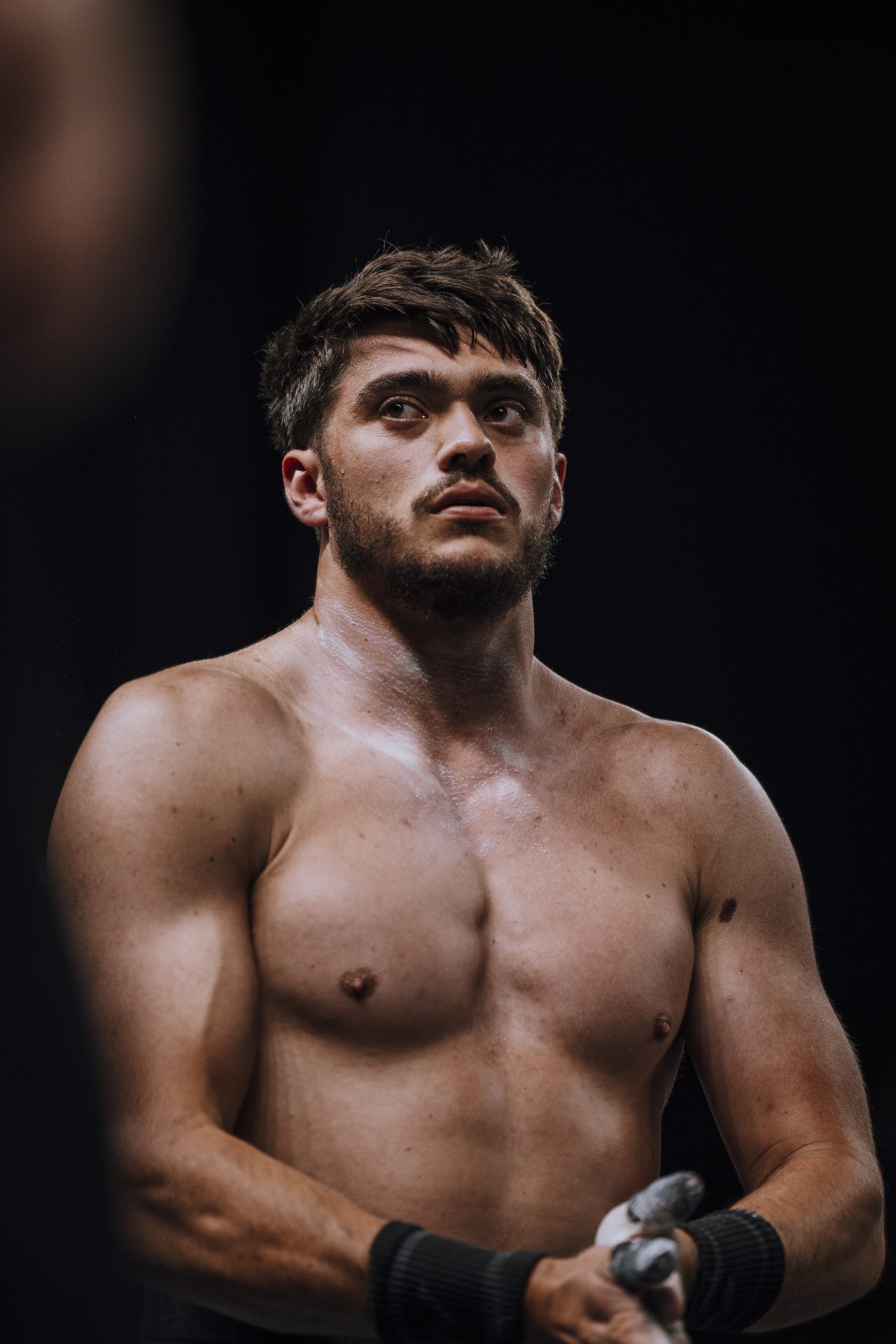 Cameron Gray wrapping his wrists before a lift
